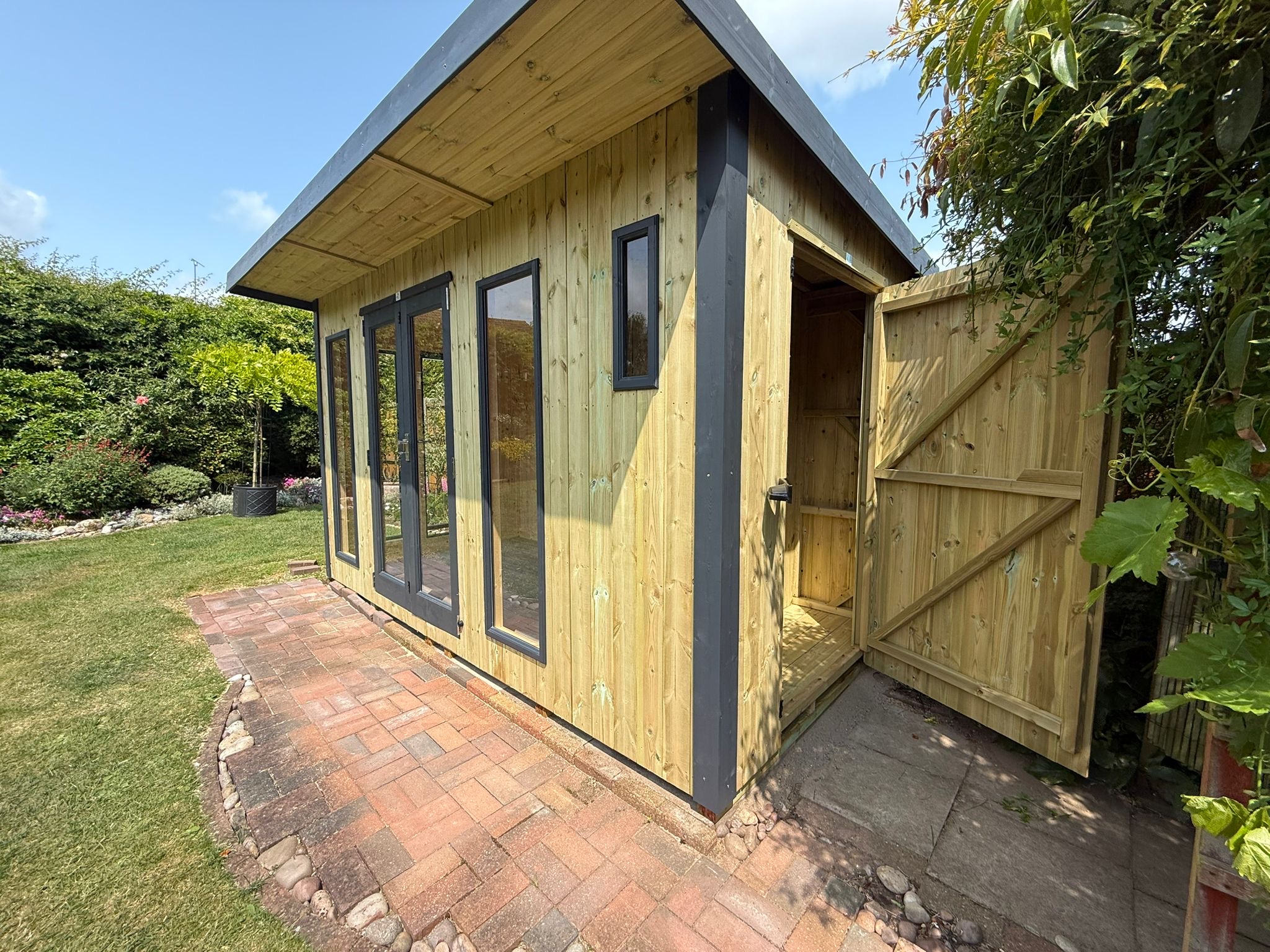 dfe3980b-34dd-4f77-b924-42b4dc1571ca Vertically Cladding Contemporary Royal Shed Combi with Pent roof and overhang. - Image 1